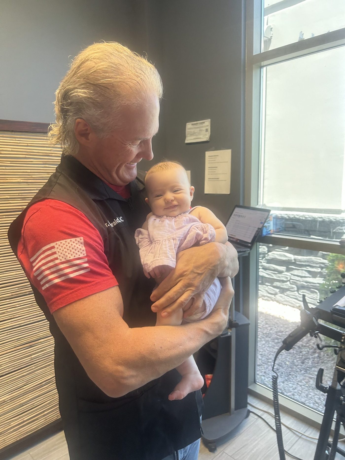 Dr. John Fitzgerald with a young patient